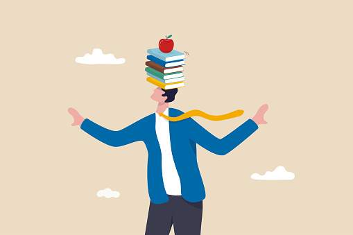 Business development books, learning or studying new skill for self improvement and success in work, education or knowledge concept, smart businessman balance books stack on his head with apple on top