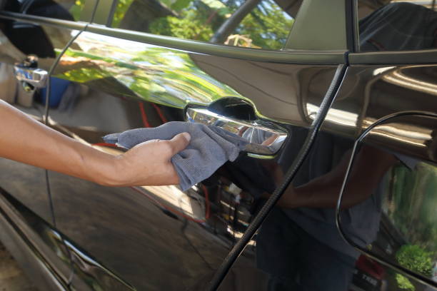 istock Wipe the car door handle with a microfiber cloth 1342010951