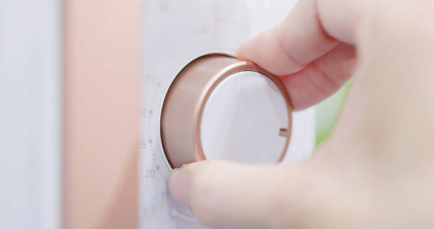 istock Turning on appliance knob 1342013218