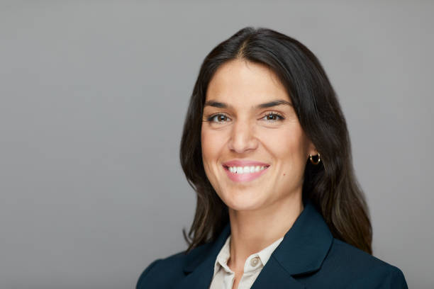 istock A smiling businesswoman cut out on a gray background. 1342014016