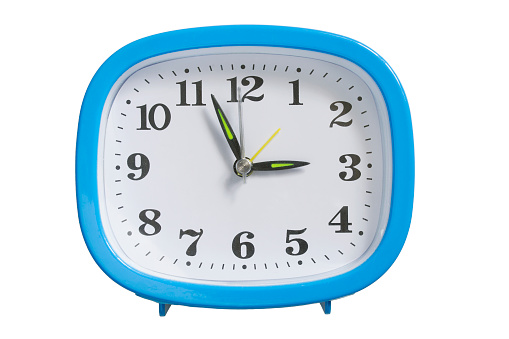 Blue plastic table clock isolated over white