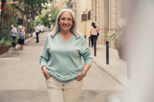 Senior woman walking in the street