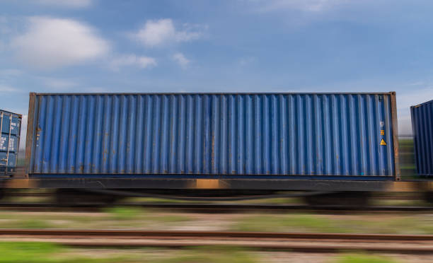 istock Train with container cargo boxes at railway station transport logistic distribution goods is industry transportion business concept. 1342016381