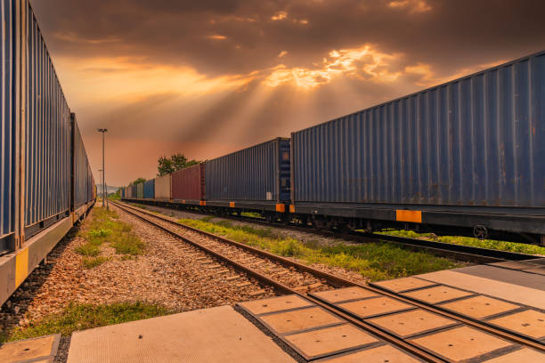 istock Train with container cargo boxes at railway station transport logistic distribution goods is industry transportion business concept. 1342016388