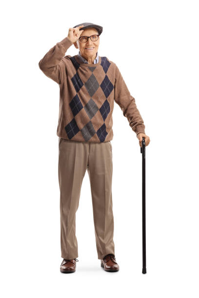 istock Senior man with a walking cane greeting with hat 1342019082