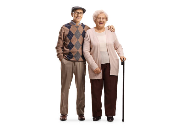 Senior man and a woman in embrace isolated on white background