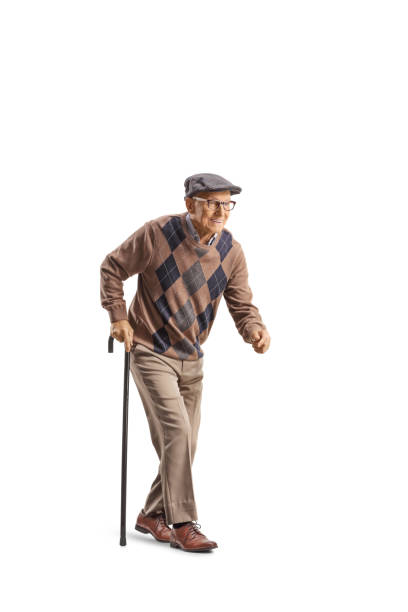 istock Senior man with a walking cane walking slowly 1342019147