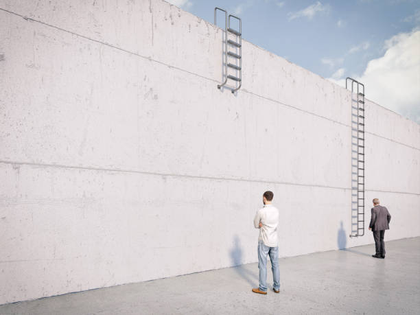 istock men with ladders of different lengths in front to overcome an obstacle 1342022819