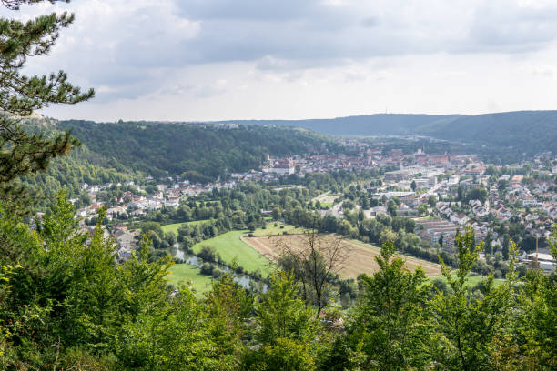 istock panoramic view over little city in a valley surrounded by hills in germany 1342023557
