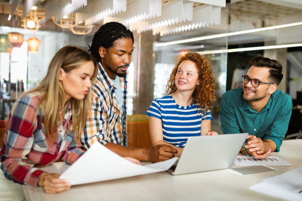 istock Business people brainstorming and chatting at workplace office 1342023618