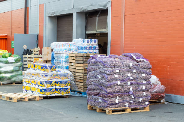 Petrozavodsk, Russia - 18 August 2021. various goods on pallets in front of the warehouse.