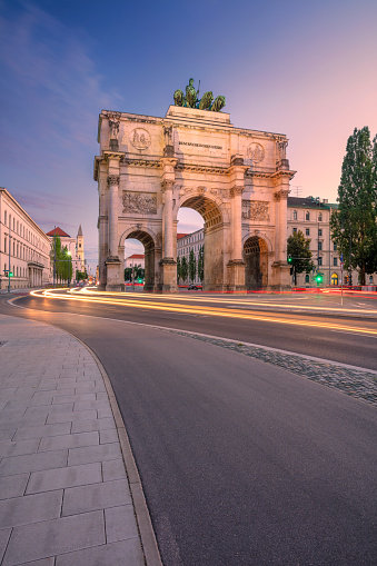 Cityscape image of Munich, Bavaria, Germany with the Siegestor at summer sunset.