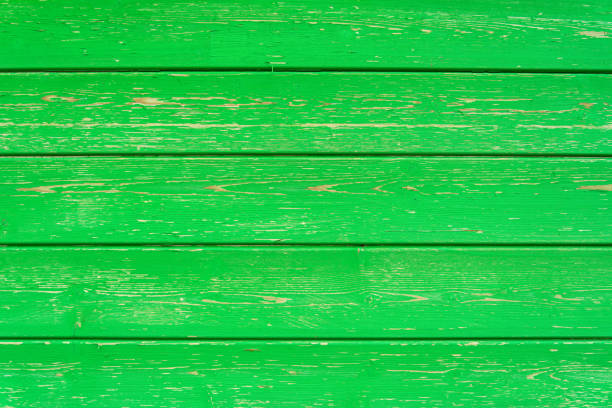 istock Light green natural boards with cracked paint structure, horizontal timber 1342034643