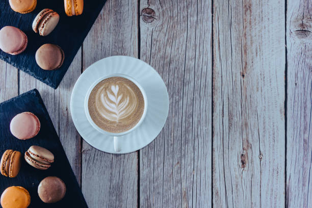 istock French pastel colored macarons dessert with coffee cup. Copy space. Selective focus. 1342035967
