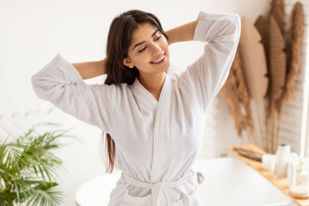 istock Lady Stretching Hands Enjoying Morning Beauty Routine In Luxury Bathroom 1342036392