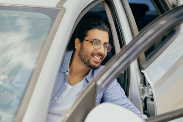 istock Successful young middle-eastern man going out the car 1342036441