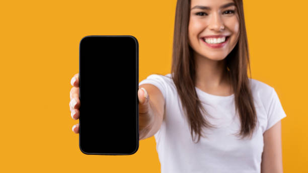 istock Lady showing white blank smartphone screen close to camera 1342037739