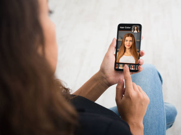 istock Over Shoulder Of Woman Using Hair Color Simulation Mobile App 1342037821