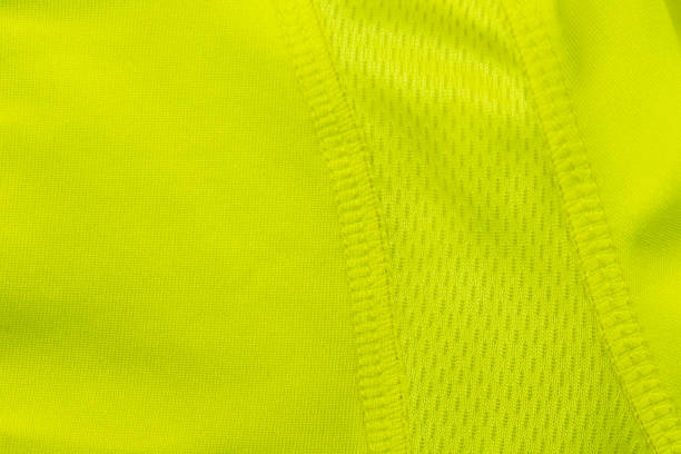 a piece of green synthetic fabric with mesh for sports. - cotton smooth green plant imagens e fotografias de stock