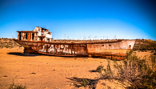 Panorama of ship cemetery near Moynaq at sunrise in Karakalpakstan, Uzbekistan - 29 april 2017