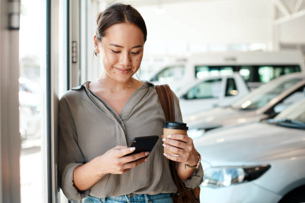 Shot of a young woman using her smartphone to send text messages This decision is so nerve wracking using phone stock pictures, royalty-free photos & images