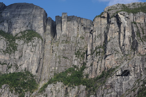 Preikestolen pulpit rock made of granite seen from below from the bottom of Lysefjord fjord and canyon in Norway in Scandinavia