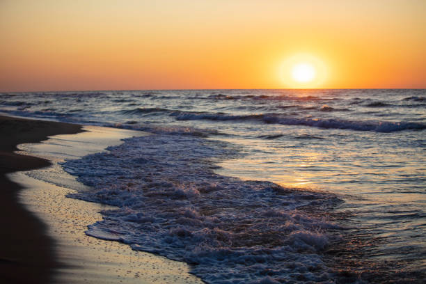 istock Beautiful sunset over the sea. Red sun and waves. 1342042949