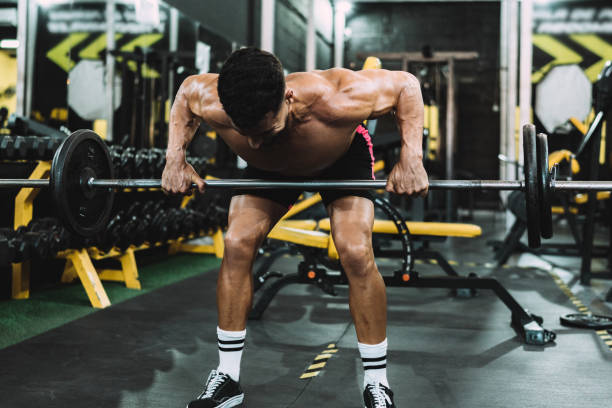 istock Strongman lifting weights with the barbell in a gym 1342043458