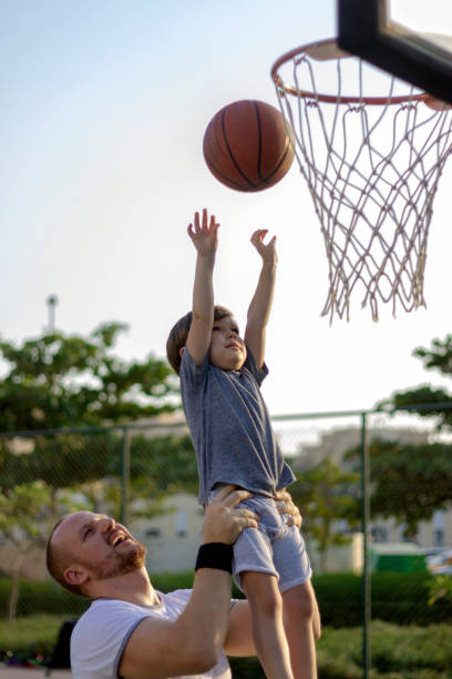 istock Father raised his son up in the air. 1342044016