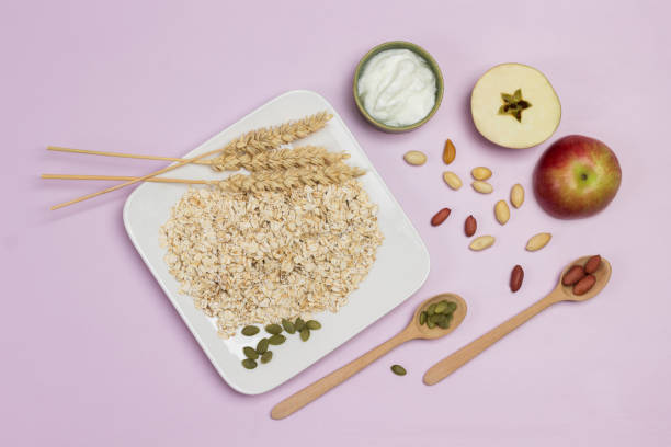 istock Spikelets of wheat and oat flakes in plate. 1342044372