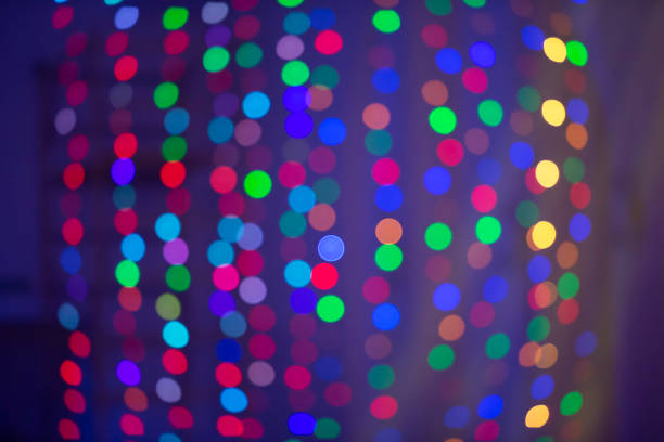 istock Multicolored bokeh spots on a blue background. Background for the holiday. 1342045644