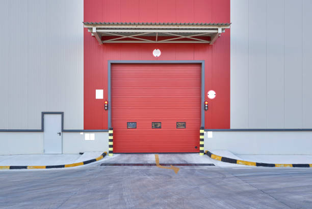 istock Shutter door or rolling door red color, at new factory construction site 1342045826