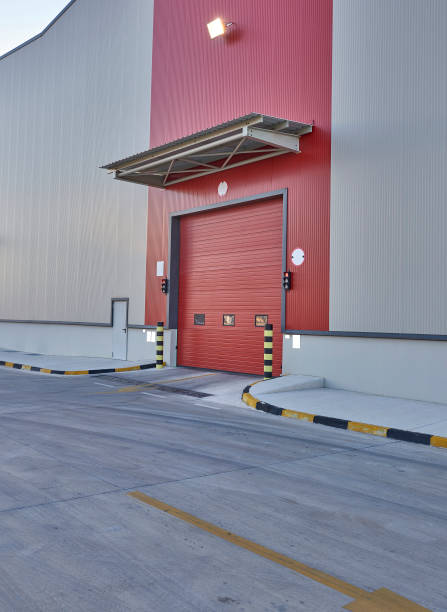 istock Shutter door or rolling door red color, at new factory construction site 1342045894
