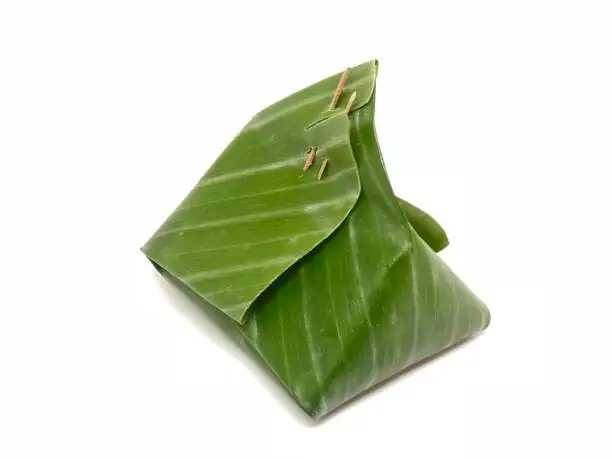 Photo of Green banana leaf food dessert wrap package