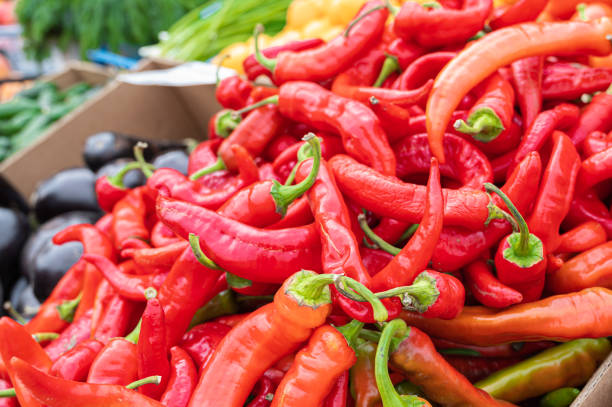 istock Red hot chilli peppers pattern texture background. Close up. Street vegetable market. Group of Red hot chilli peppers 1342048629