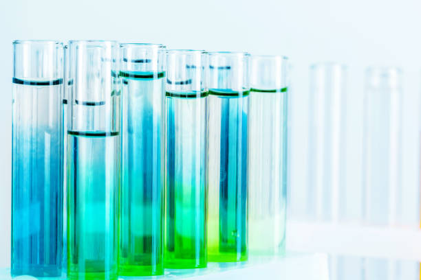 istock Different laboratory glassware with colored liquids close up 1342048639