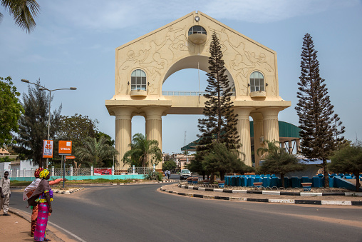 Banjul, The Gambia - may 09, 2017: Road and view of Arch 22 at the main entrance of the city