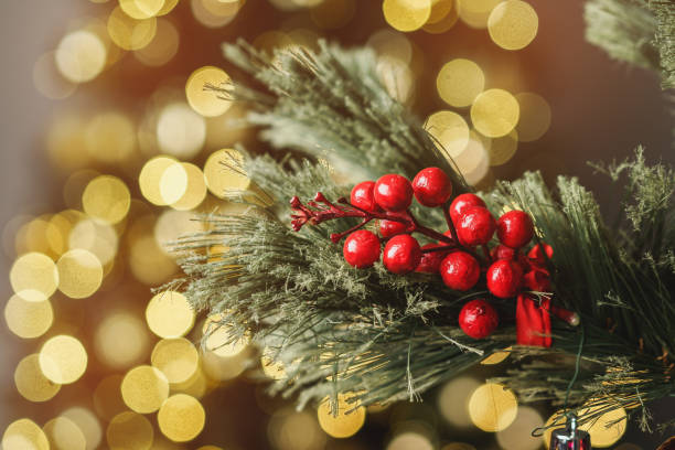 istock Christmas pine tree branch with decorations close up 1342049597