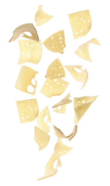 istock Collage with slices of cheese falling on white background 1342051567
