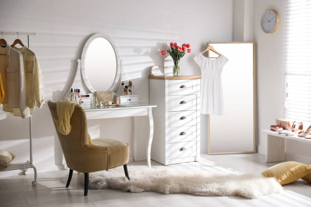 istock Stylish room interior with elegant dressing table, mirror and comfortable chair 1342053582