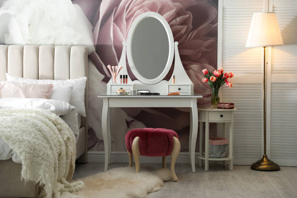 istock Stylish bedroom interior with elegant dressing table and floral wallpaper 1342053714