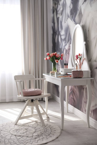istock Stylish room interior with elegant dressing table and floral wallpaper 1342053872