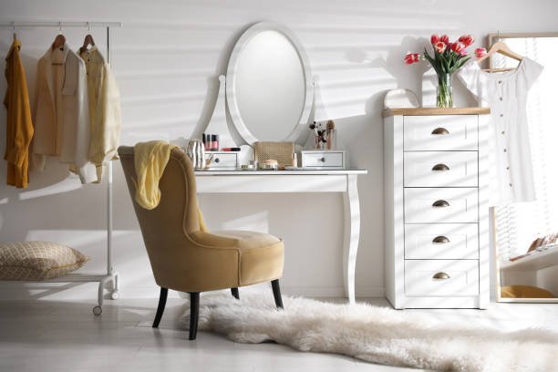 istock Stylish room interior with elegant dressing table, mirror and comfortable chair 1342053909