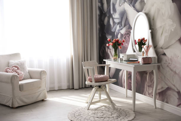 istock Stylish room interior with elegant dressing table and floral wallpaper 1342054000