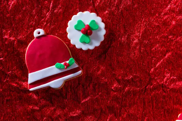 Christmas cookies Xmas bell on red background with copy space