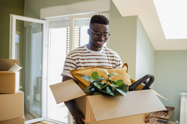 istock Young man moving into a new apartment 1342056283