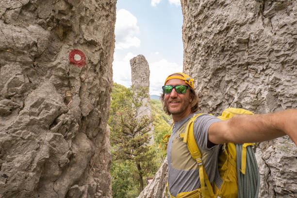 istock Mountain climber takes selfie at pinnacle rocks 1342056455