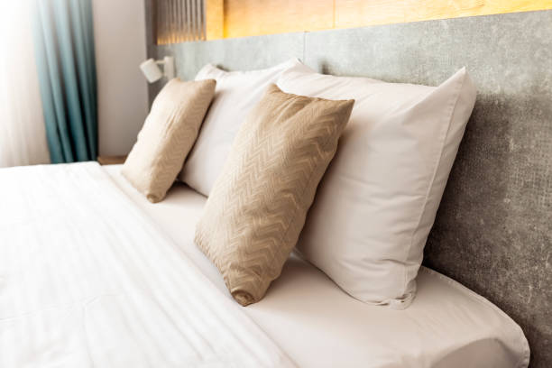 istock Beautiful comfortable pillow on bed decoration 1342056713