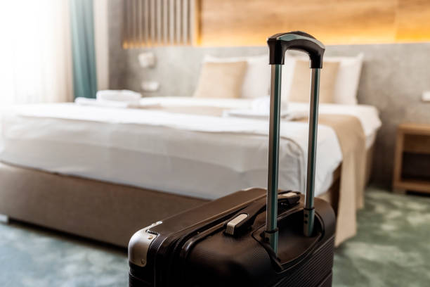 istock Suitcase in hotel room 1342057164