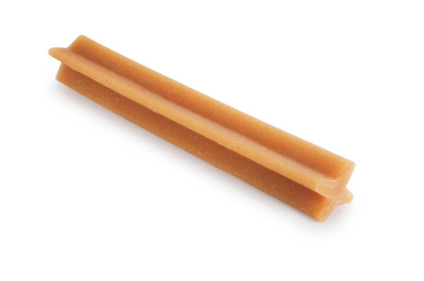Studio shot of a dental dog chew cut out against a white background